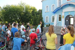 Religious procession on a bicycle in Kalinkovichi 